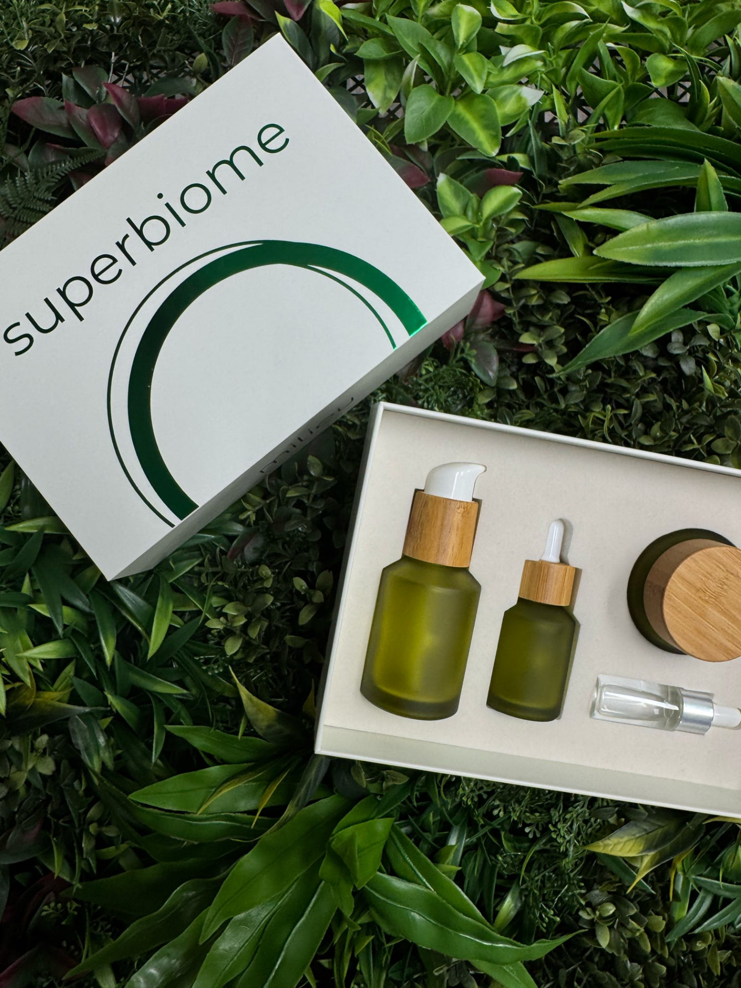 Milieu Superbiome kit flat lay on greenery